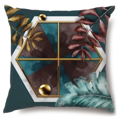 Decorative pillow with geometric design and leaf patterns on a white background